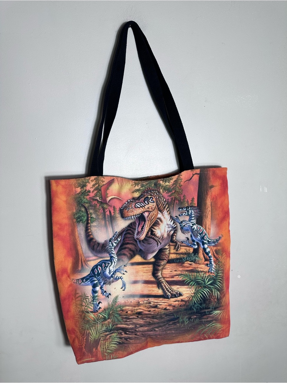 The Mountain Orange Dinosaur Messenger Bag with Black Straps